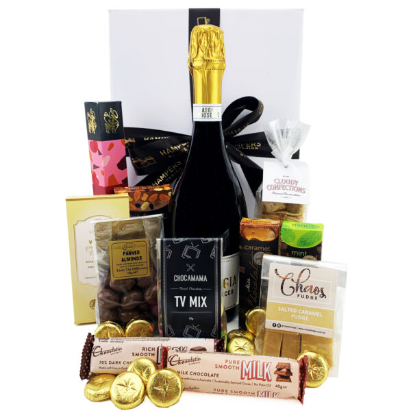 Gift box with champagne, choclolates and other sweet foods items